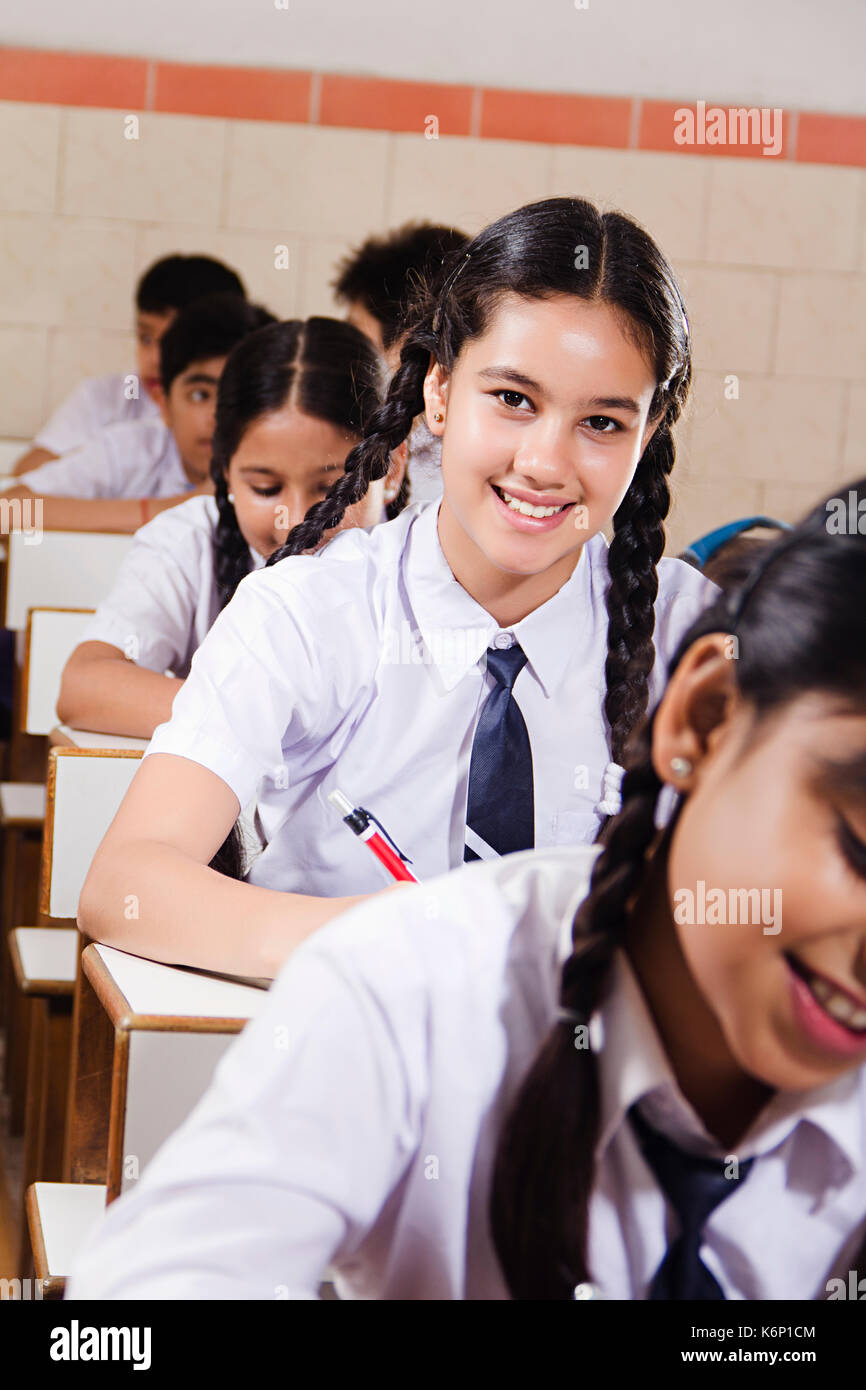 Indian Group High School Students Studying Education In Classroom Stock Photo