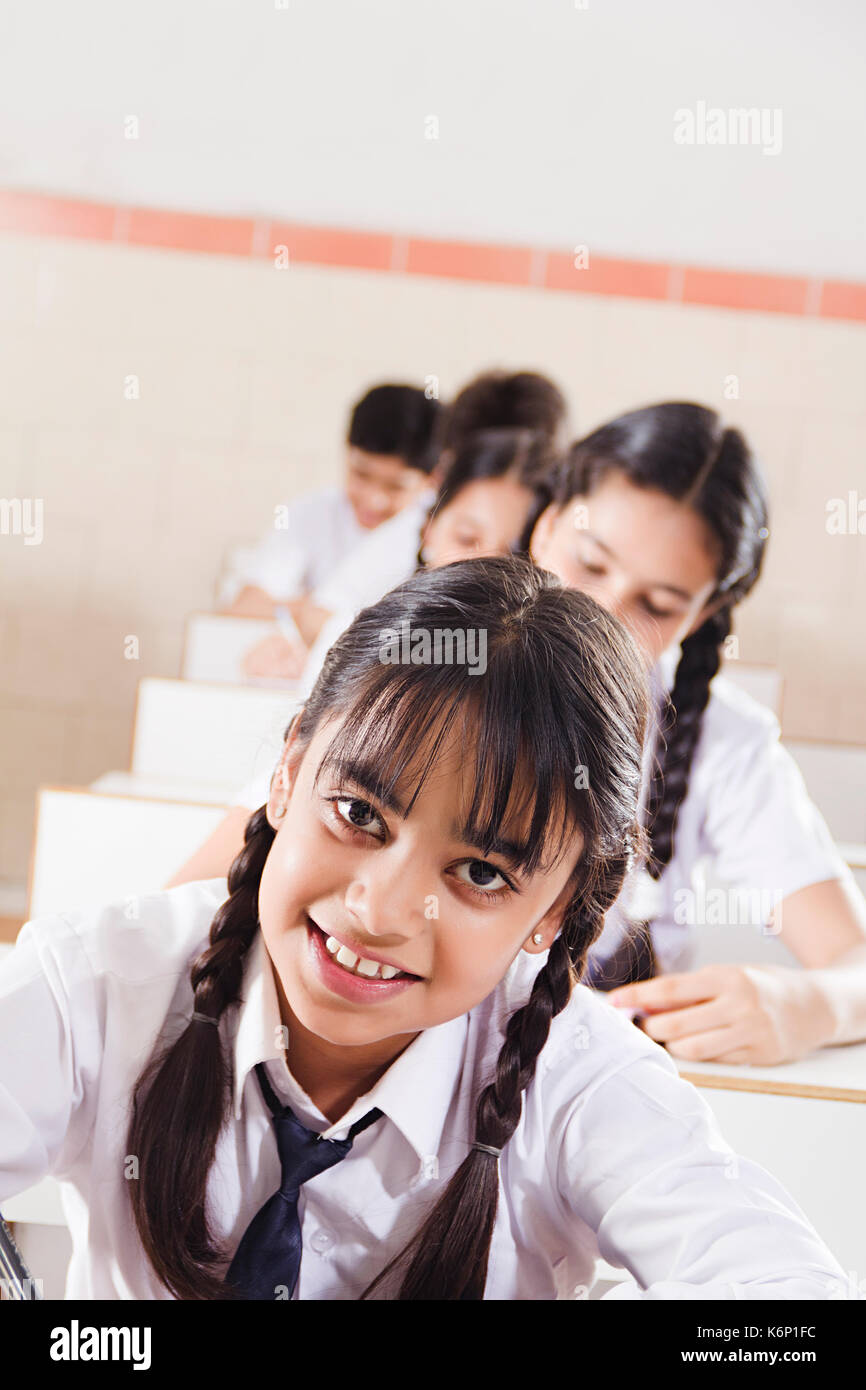 Smiling 1 Indian High School Girl Student Studying Education In Classroom Stock Photo