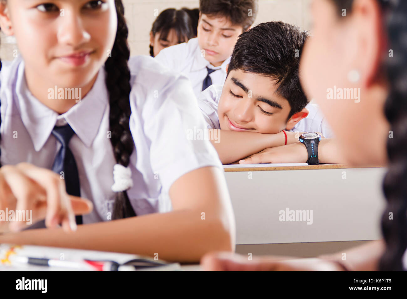 High School Boy Student Sleeping In Glass With Classmate Stock Photo