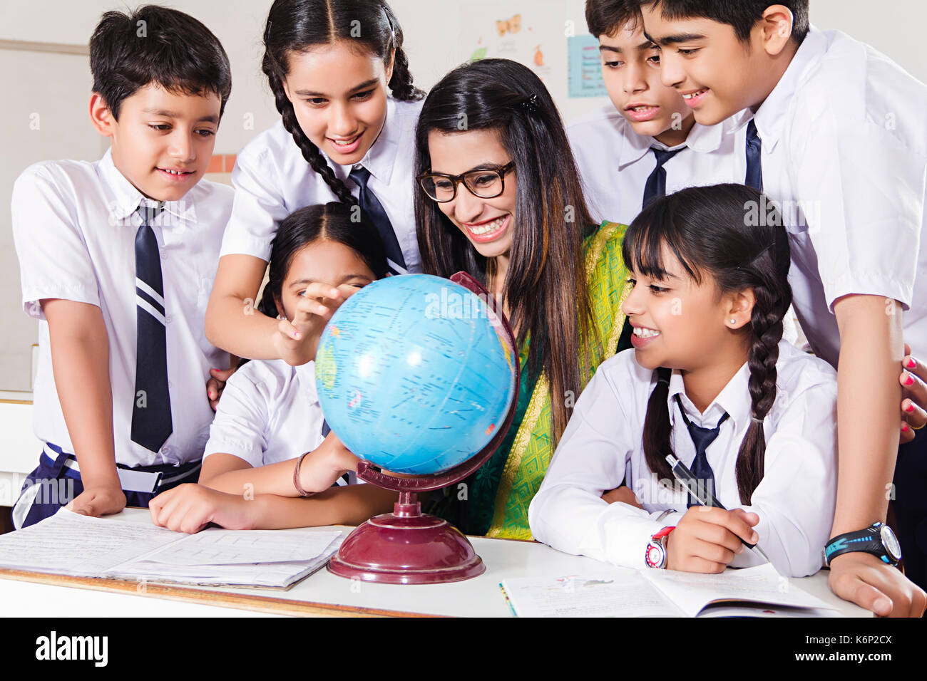 Group Kids School Students And Teacher World Globe Studying In Classroom Education Learning Stock Photo