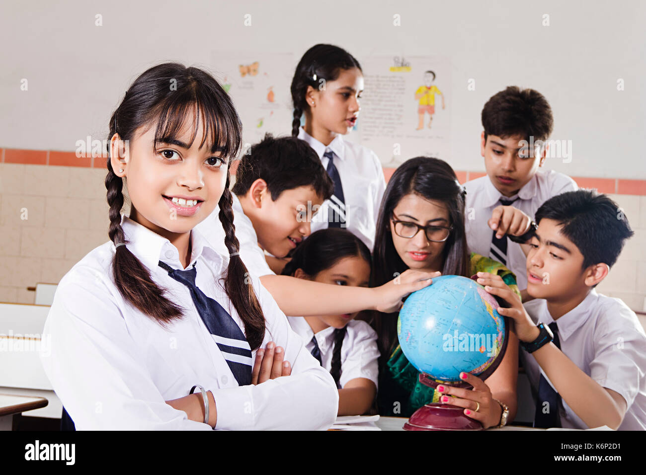 Group School Students And Teacher. 1 School Girl Standing In Classroom Education Learning Stock Photo