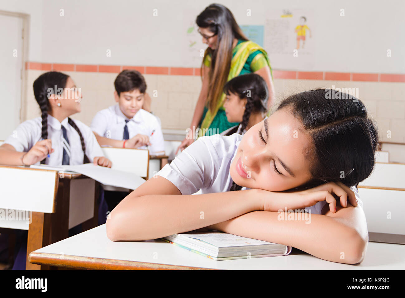 1 Indian Girl High School Student Sleeping In Classroom Stock Photo