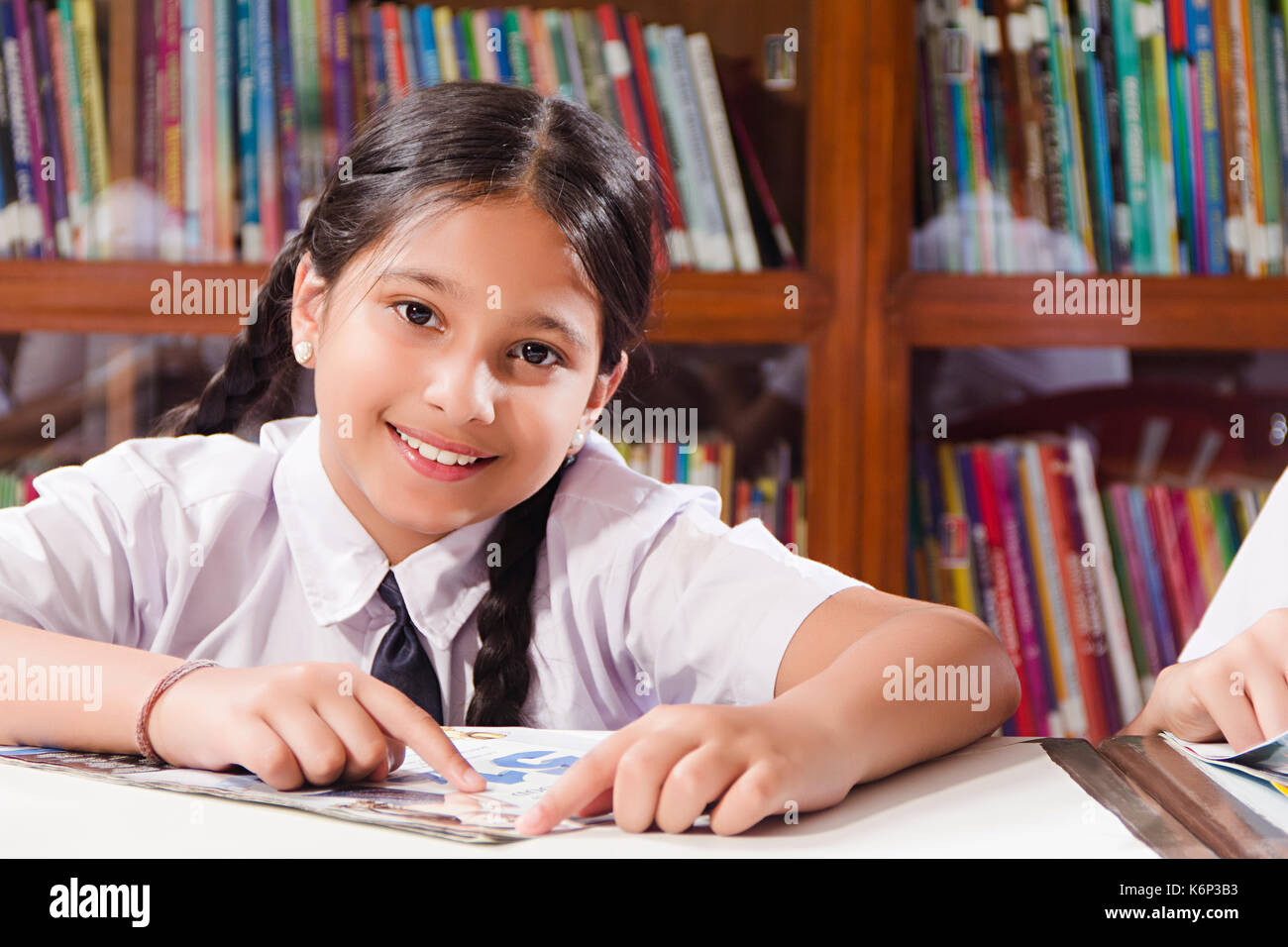 1 Indian School Girl Student Reading Book Study Education In Library Stock Photo