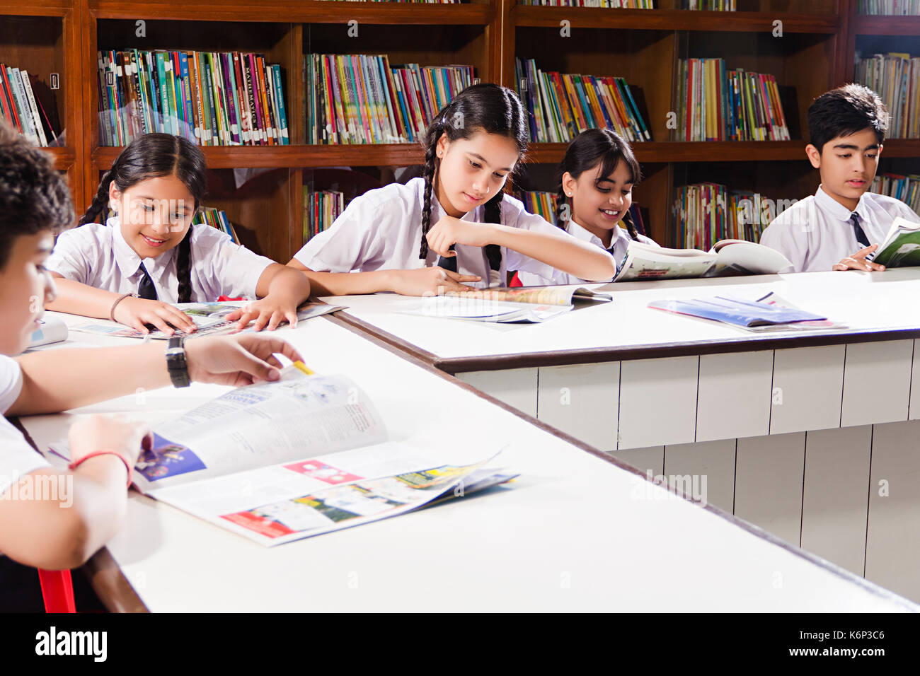 Indian School Kids Students Reading Book Study Education In Library