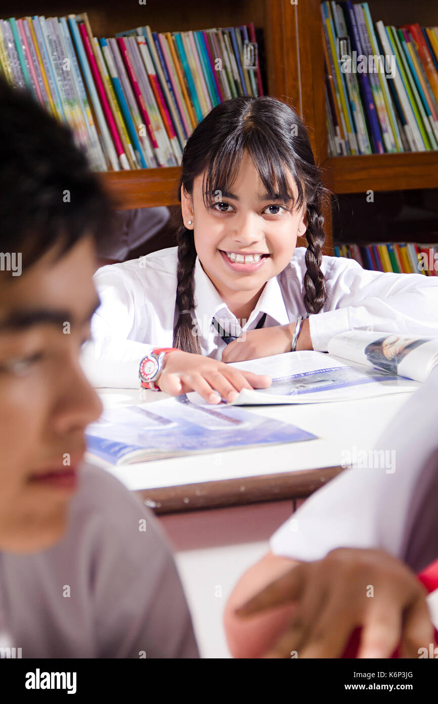 1 Indian School Girl Student Reading Book Study Education In Library ...