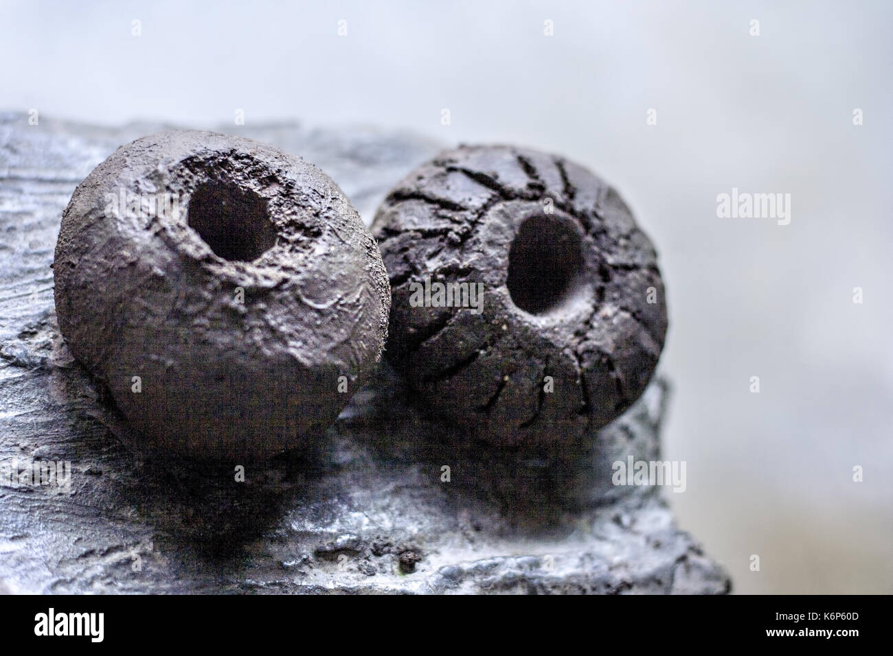 Two toys of mud Stock Photo Alamy
