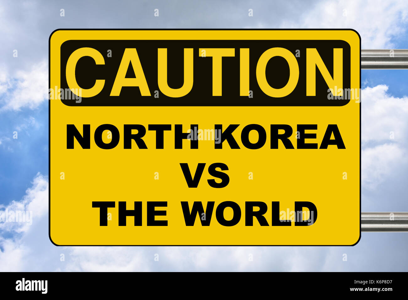 North Korea VS the world, yellow warning road sign Stock Photo