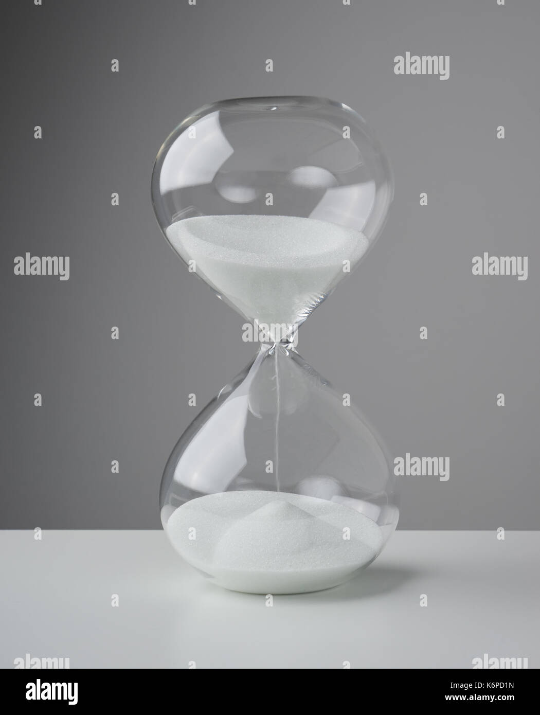 Studio photo of a hourglass,sand clock, business time management concept . Stock Photo