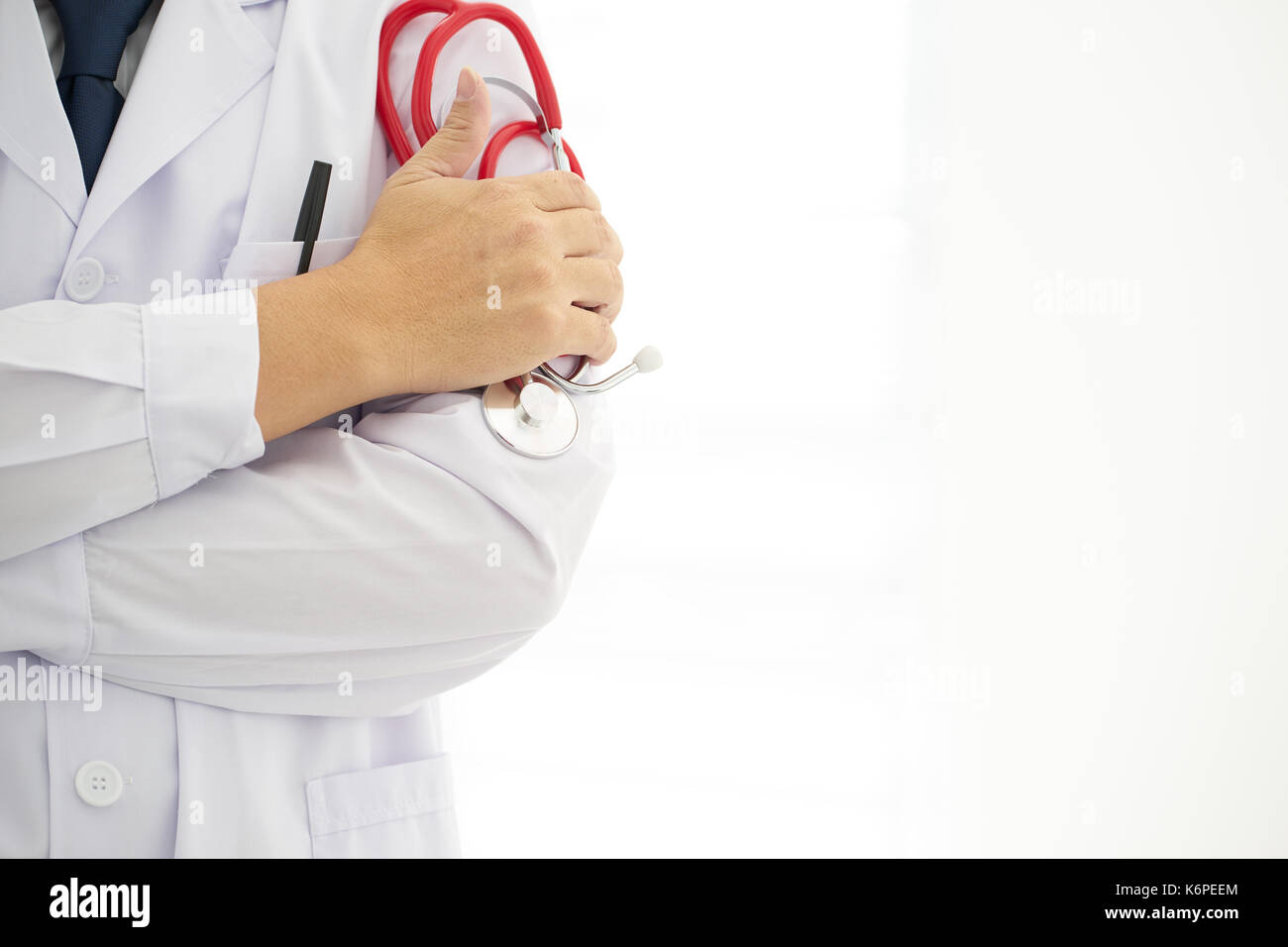 Portrait an unknown young male doctor holding a stethoscope Stock Photo ...