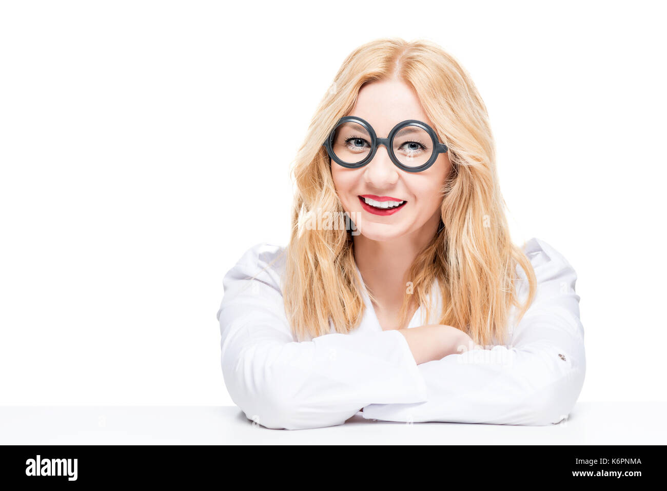 blonde with glasses in a robe doctor on a white background Stock Photo