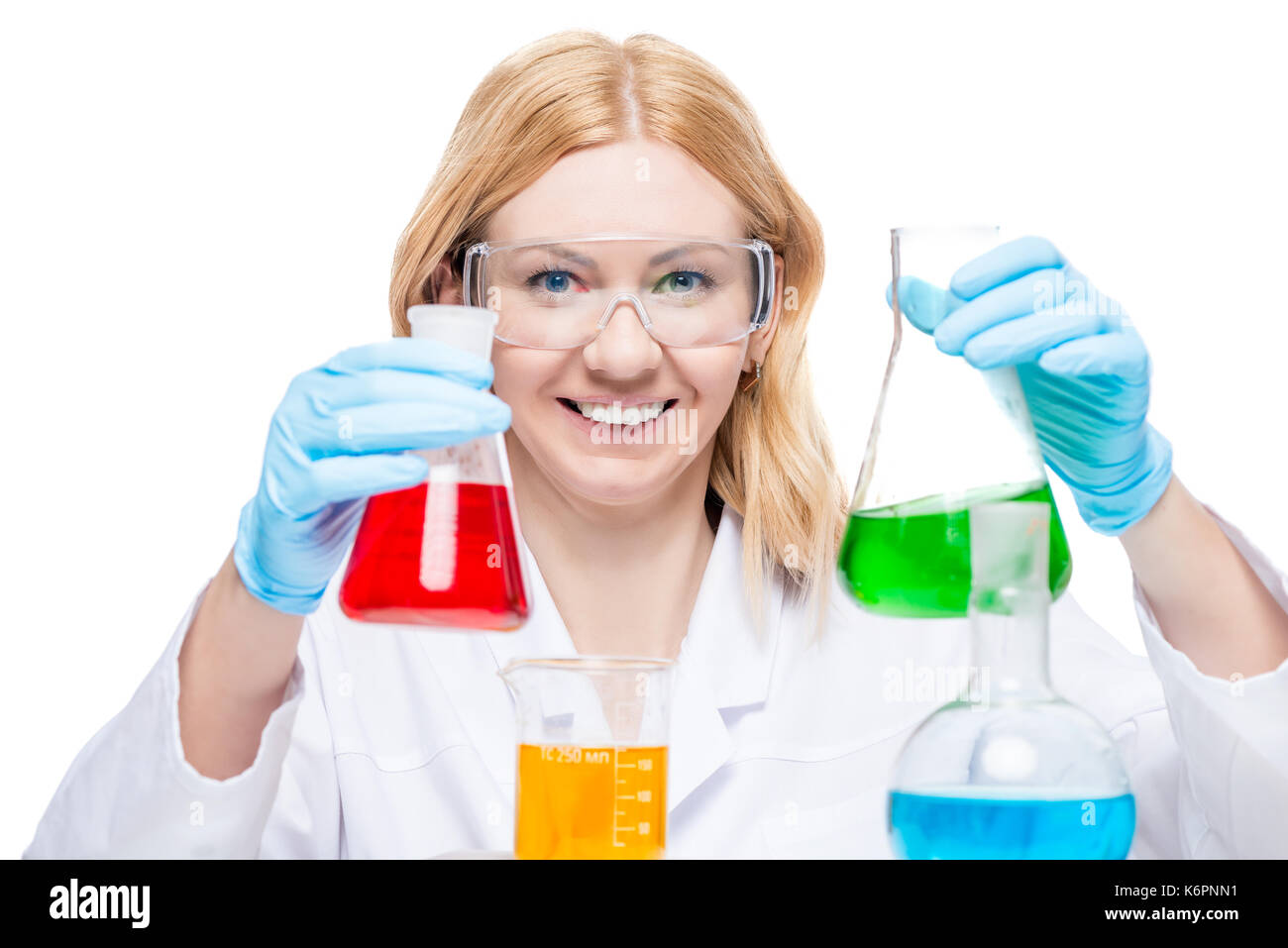 happy chemist in a laboratory with test tubes and flasks on a white ...