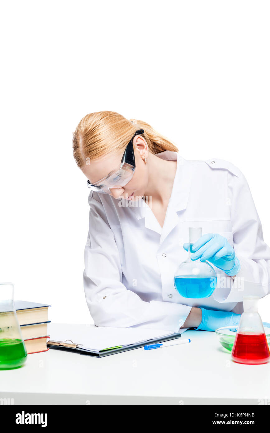 Girl chemist lab assistant doing analysis at the table Stock Photo
