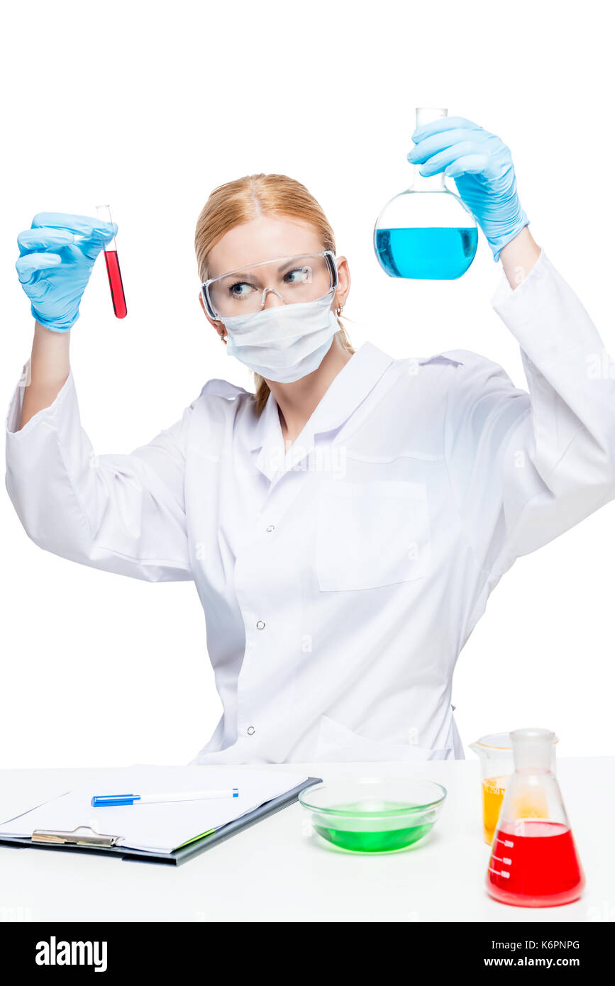 Woman chemist lab assistant with test tubes doing substance analysis ...