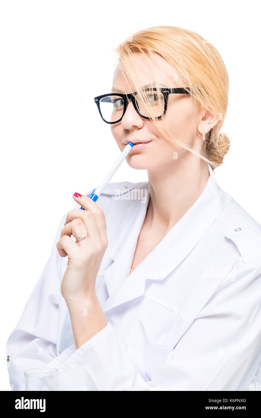 Woman doctor in glasses with pen posing in studio on white background Stock Photo
