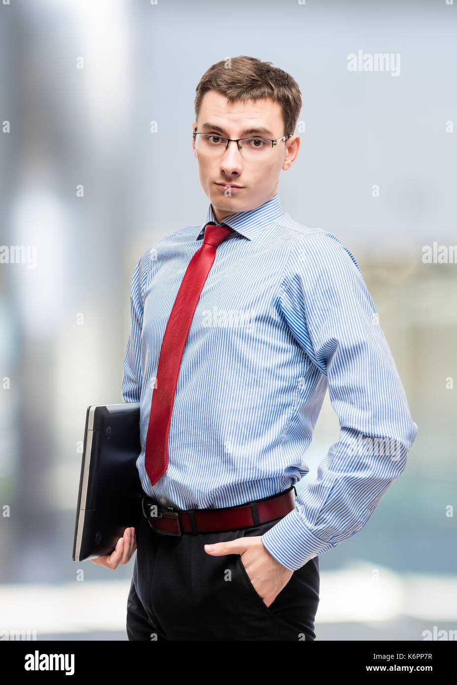 Male chief accountant with laptop posing in office Stock Photo - Alamy