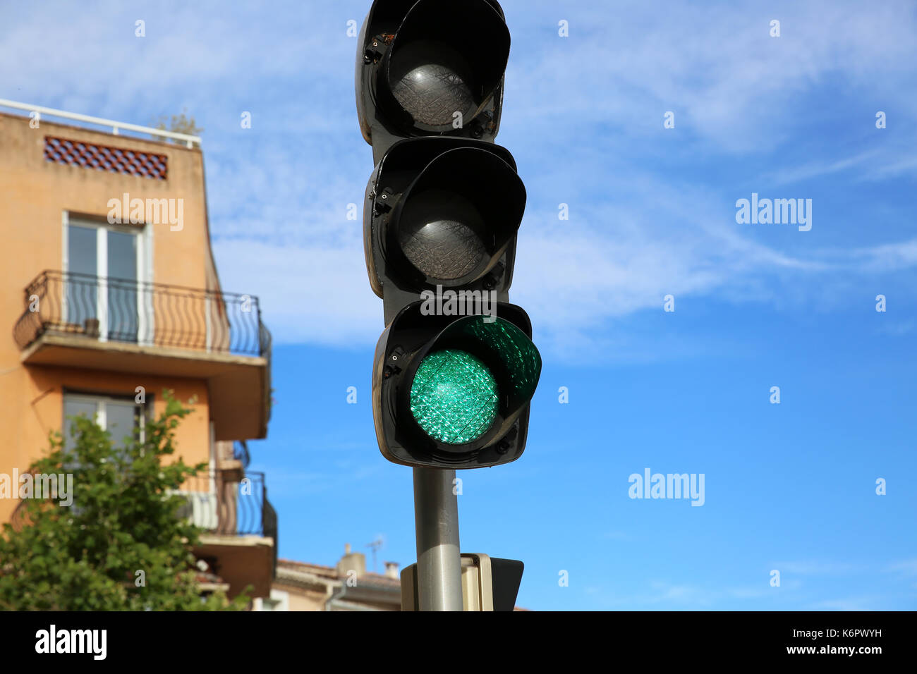 Close Up of Green Illuminated on Traffic Light Stock Photo - Alamy