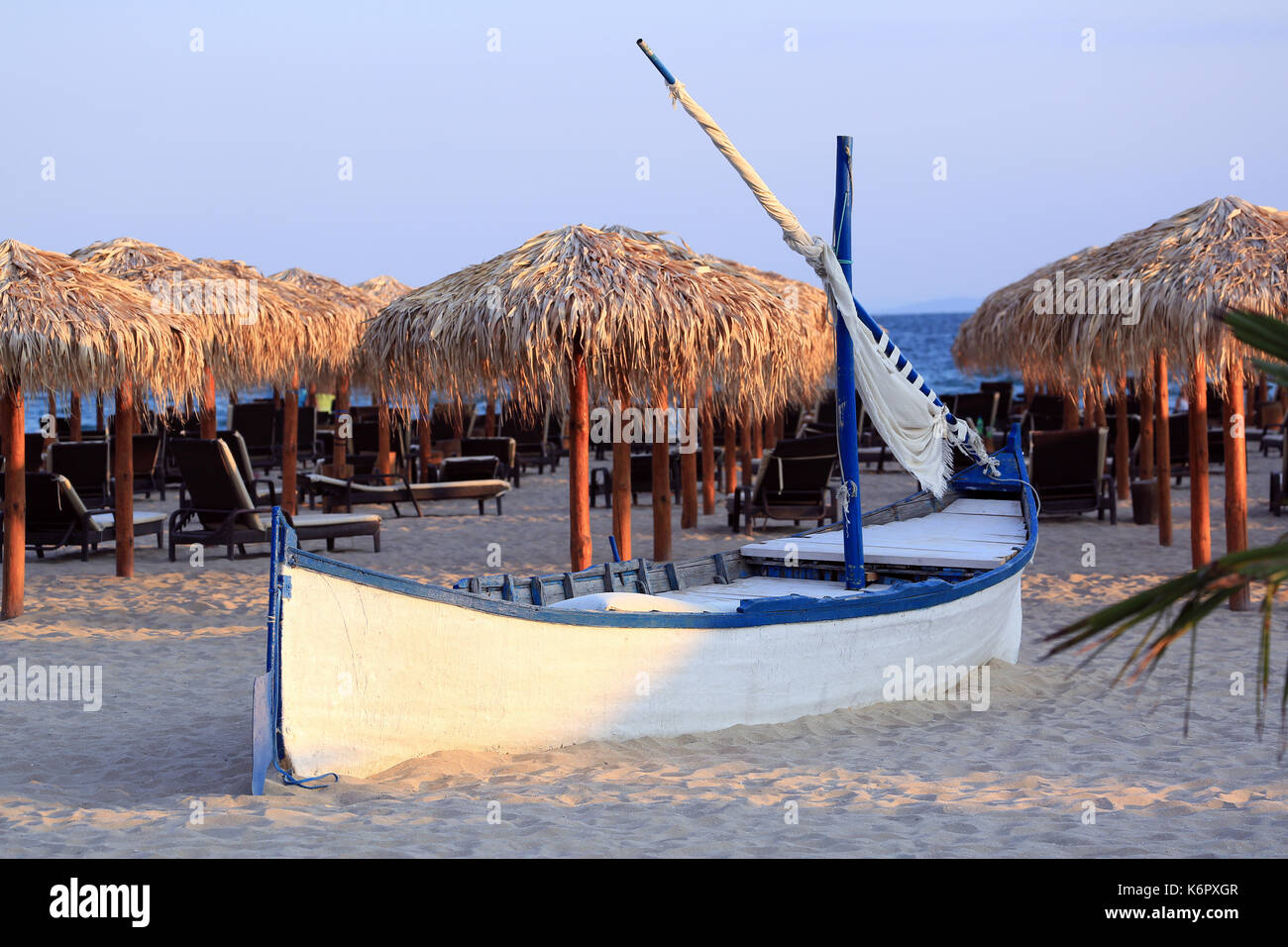 Wooden Boat With Straw Parasols in the Background. Beach of the Black
