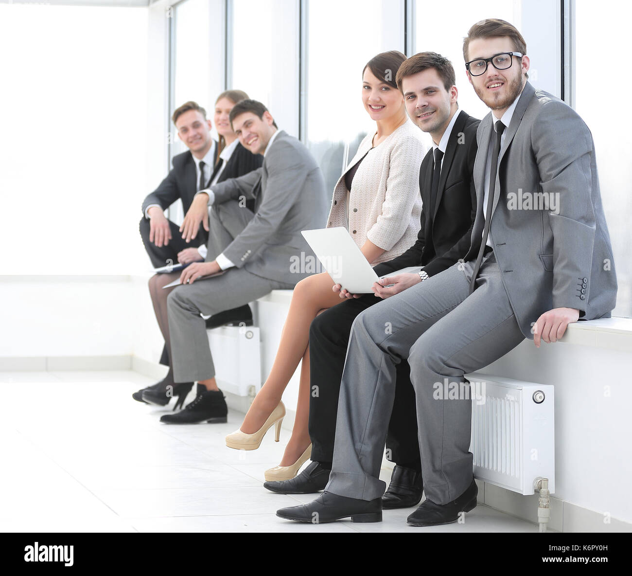 business team sitting in the lobby of the office Stock Photo - Alamy