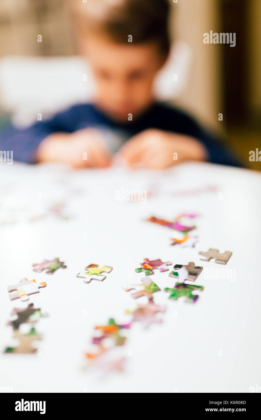 2 year old child solving jigsaw puzzle Stock Photo Alamy
