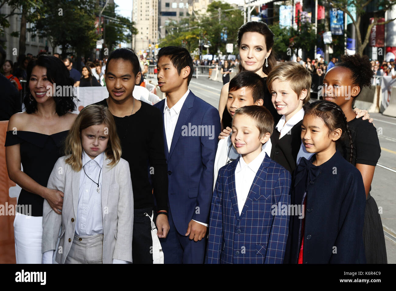 Toronto, Kanada. 11th Sep, 2017. Loung Ung, Vivienne Marcheline Jolie-Pitt, Maddox Jolie-Pitt, Pax Thien Jolie-Pitt, Kimhak Mun, Knox Leon Jolie-Pitt, Shiloh Jolie-Pitt, Angelina Jolie, Zahara Jolie-Pitt and Sareum Srey Moch attending the 'First They Killed My Father: A Daughter of Cambodia Remembers' premiere during the 42nd Toronto International Film Festival at Princess of Wales Theatre on September 11, 2017 in Toronto, Canada | Verwendung weltweit/picture alliance Credit: dpa/Alamy Live News Stock Photo