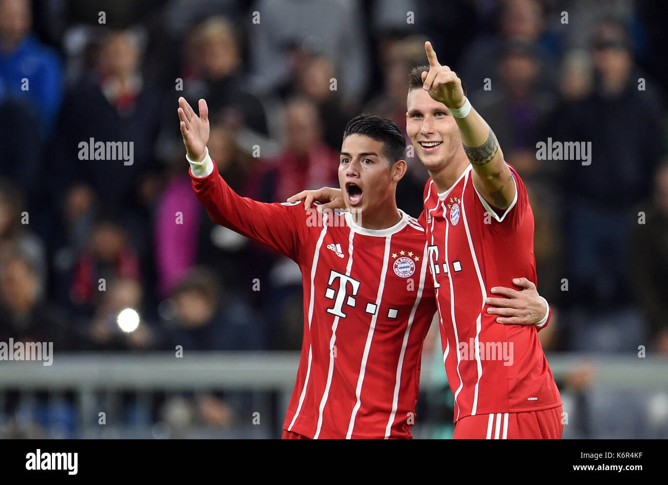 Munich, Germany. 12th Sep, 2017. Muenchen's Niklas Suele (R) celebrates his still invalid goal next to James Rodriguez during the Champions League Group B match between Bayern Muenchen and RSC Anderlecht at the Allianz Arena in Munich, Germany, 12 September 2017. Photo: Andreas Gebert/dpa/Alamy Live News Stock Photo