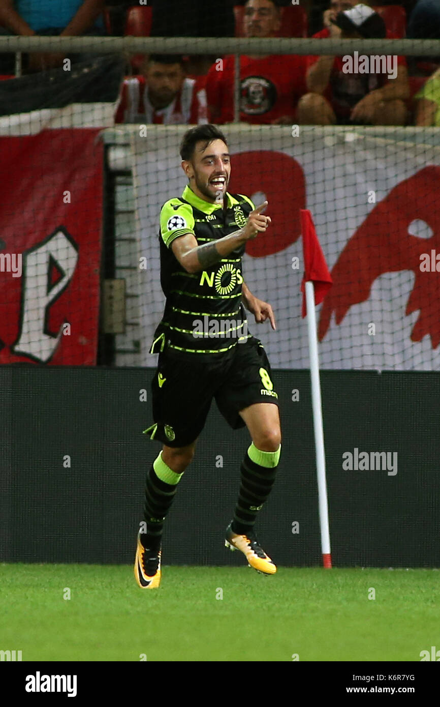 Lisbon's Bruno Fernandes (C) celebrates after scoring the 03 during a