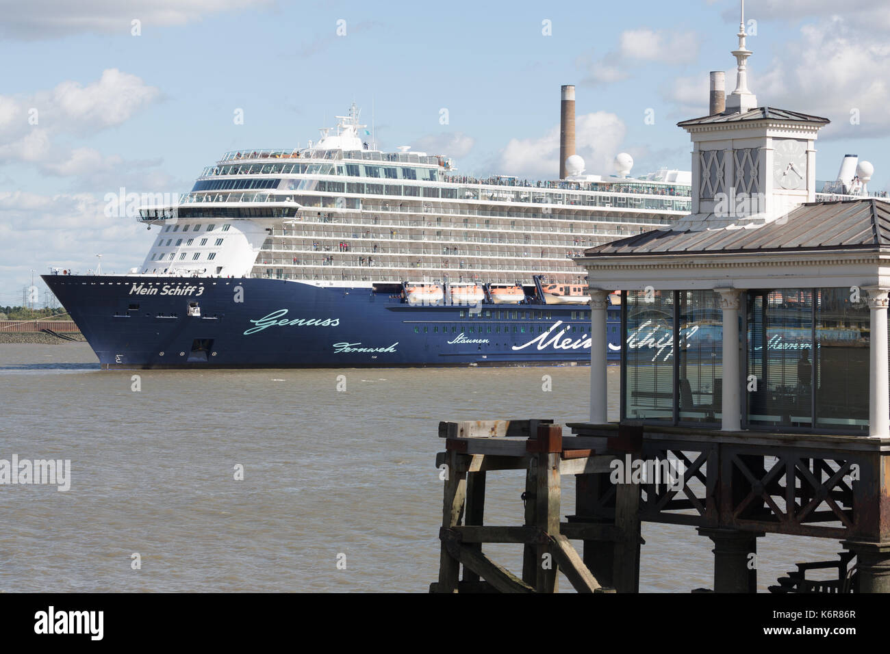 Gravesend, Kent, UK. 13th Sep, 2017. The biggest cruise ship to ever visit London International Cruise Terminal at Tilbury, and possibly the Thames, has departed the river. 293 metre long Mein Schiff 3 dwarfed Gravesend as she passed by. The ship's departure was delayed twice because of Storm Aileen. Credit: Rob Powell/Alamy Live News Stock Photo