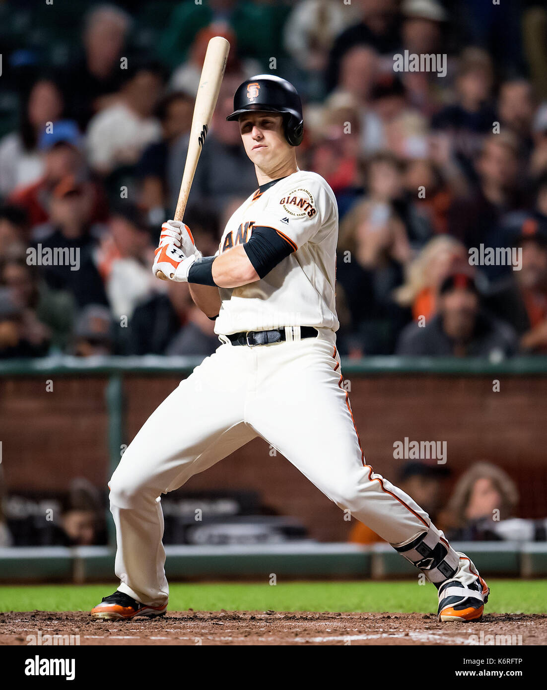 San Francisco, California, USA. 13th Sep, 2017. San Francisco Giants first baseman Buster Posey (28) takes an inside pitch in the second inning, during a MLB game between the Los Angeles Dodgers and the San Francisco Giants at AT&T Park in San Francisco, California. Valerie Shoaps/CSM/Alamy Live News Stock Photo