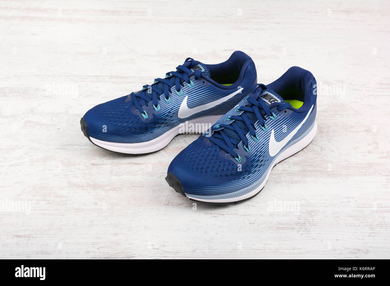 BURGAS, BULGARIA - SEPTEMBER 6, 2017: Nike Air Zoom Pegasus 34 Women's  Running Shoes in blue on white wooden background. Nike is a global sports  cloth Stock Photo - Alamy