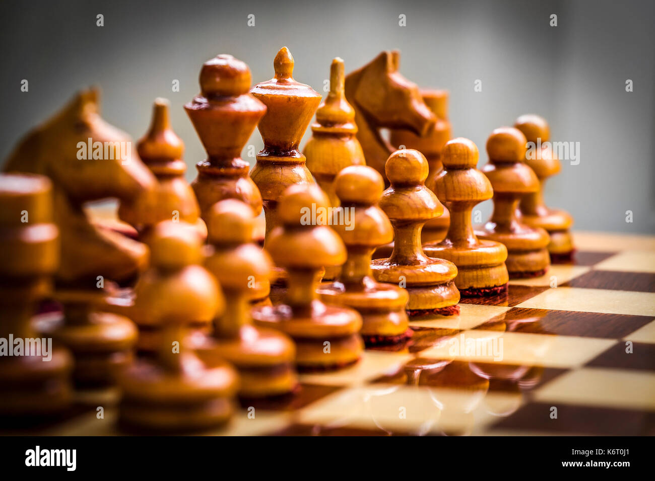 Set of white chess pieces on the board close up. Stock Photo