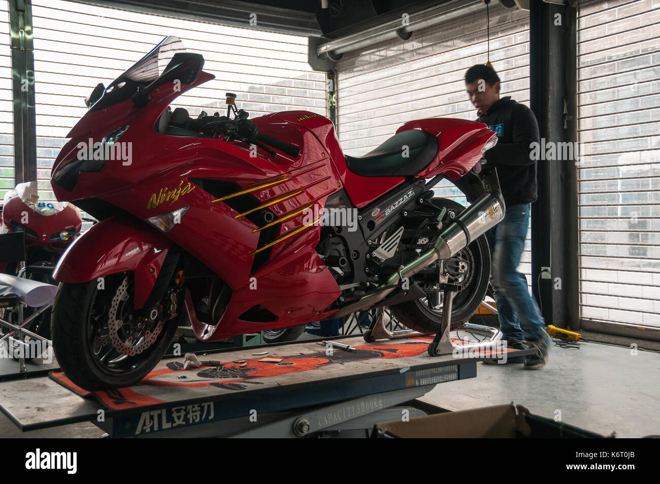 Kawasaki ZX1400 undergoing the finishing touches after fitting a new  exhaust, Brembo brakes and gold coloured highlights at BG Tech Center Stock  Photo - Alamy