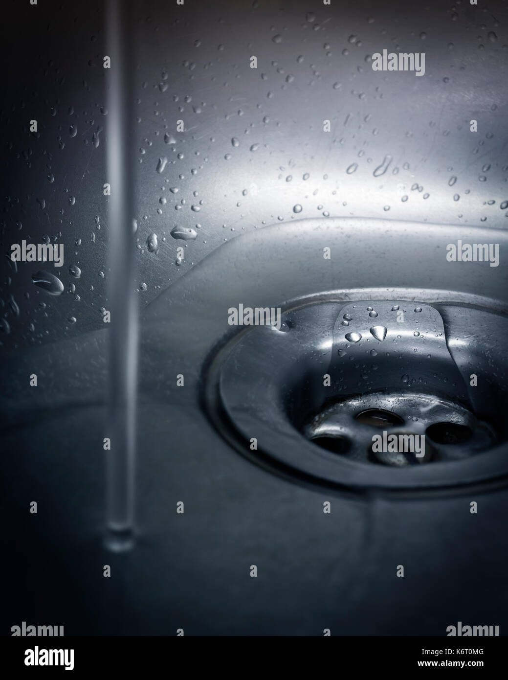 Drain hole in the kitchen sink closeup Stock Photo Alamy
