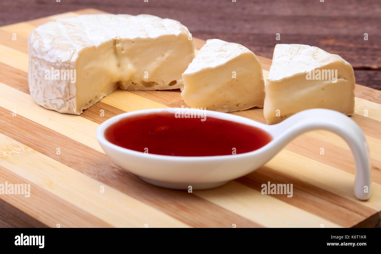 Cheese with white mold. Camembert or brie type with Cranberry sauce
