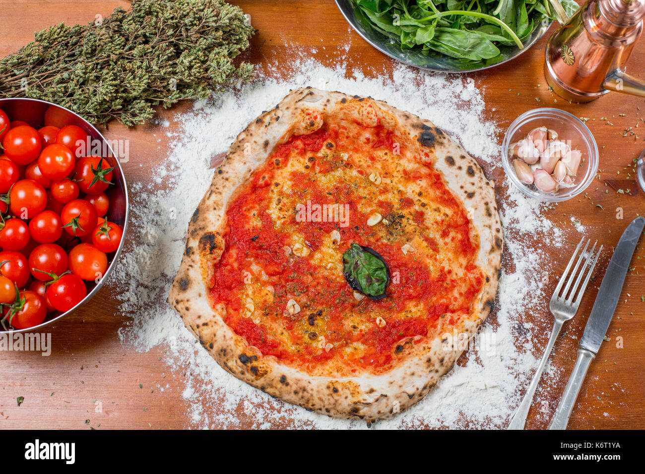 Traditional italian pizza with tomato sauce garlic basil and