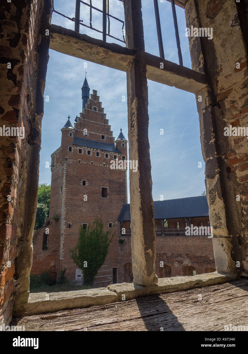 Peeking through the window of a castle ruin. Stock Photo