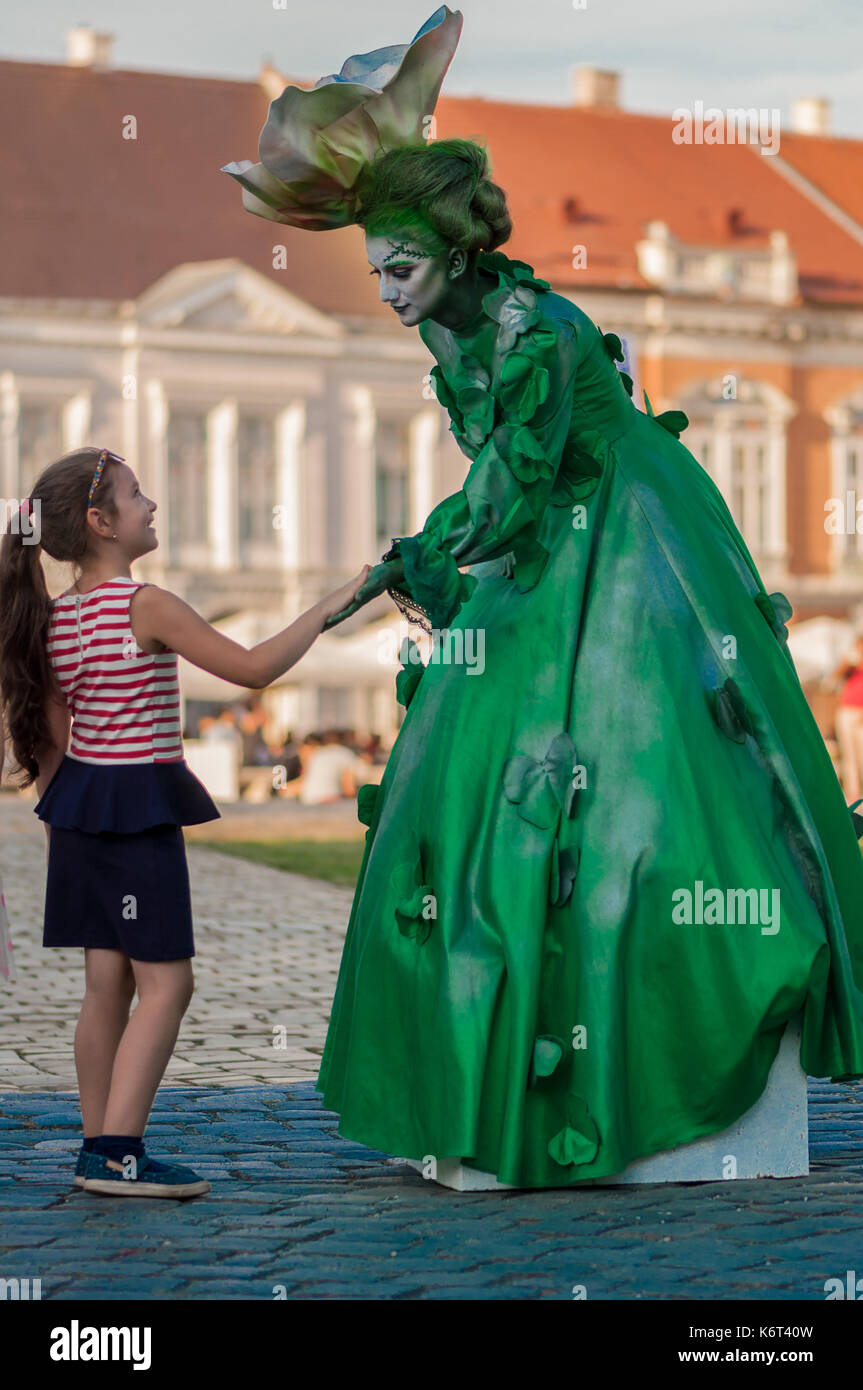 Woman in a green dress hi-res stock photography and images - Alamy