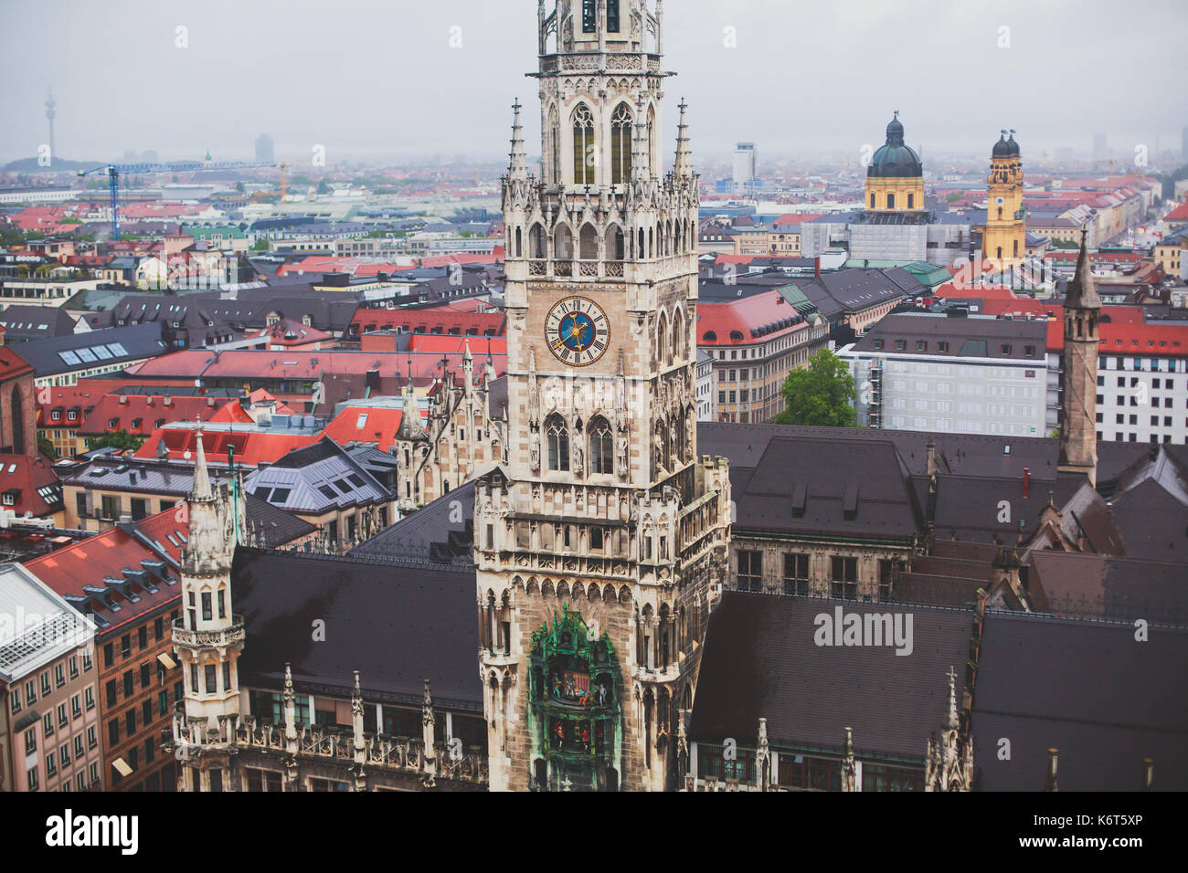 Beautiful super wide-angle sunny aerial view of Munich, Bayern, Bavaria, Germany with skyline and scenery beyond the city, seen from the observation d Stock Photo