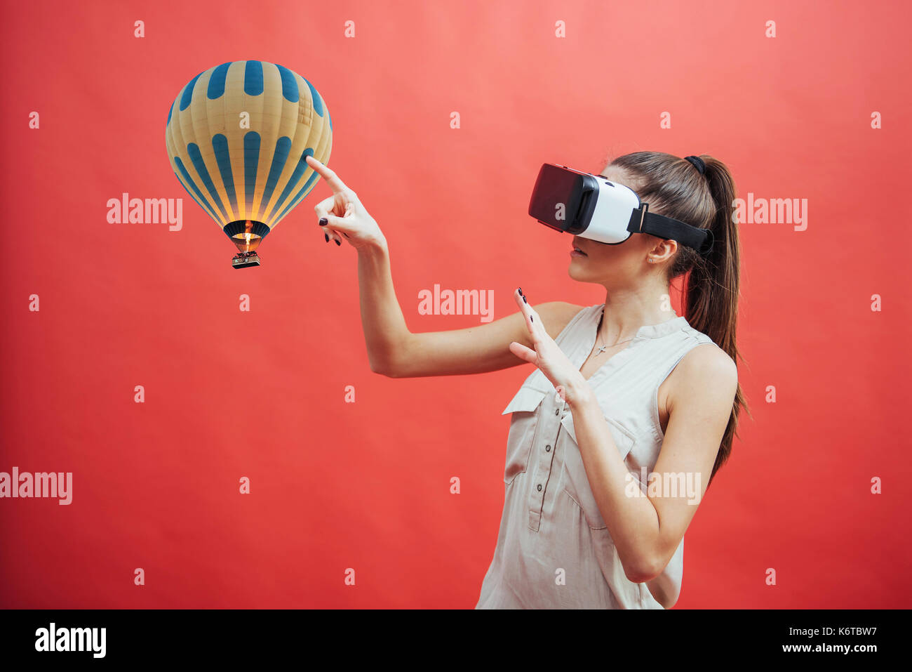 Visual reality concept. Young man using Visual reality or VR headset and interacting with object Stock Photo