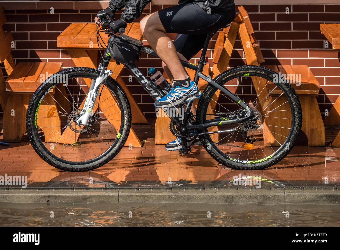 Man cycling on rainy wet hi-res stock photography and images - Alamy