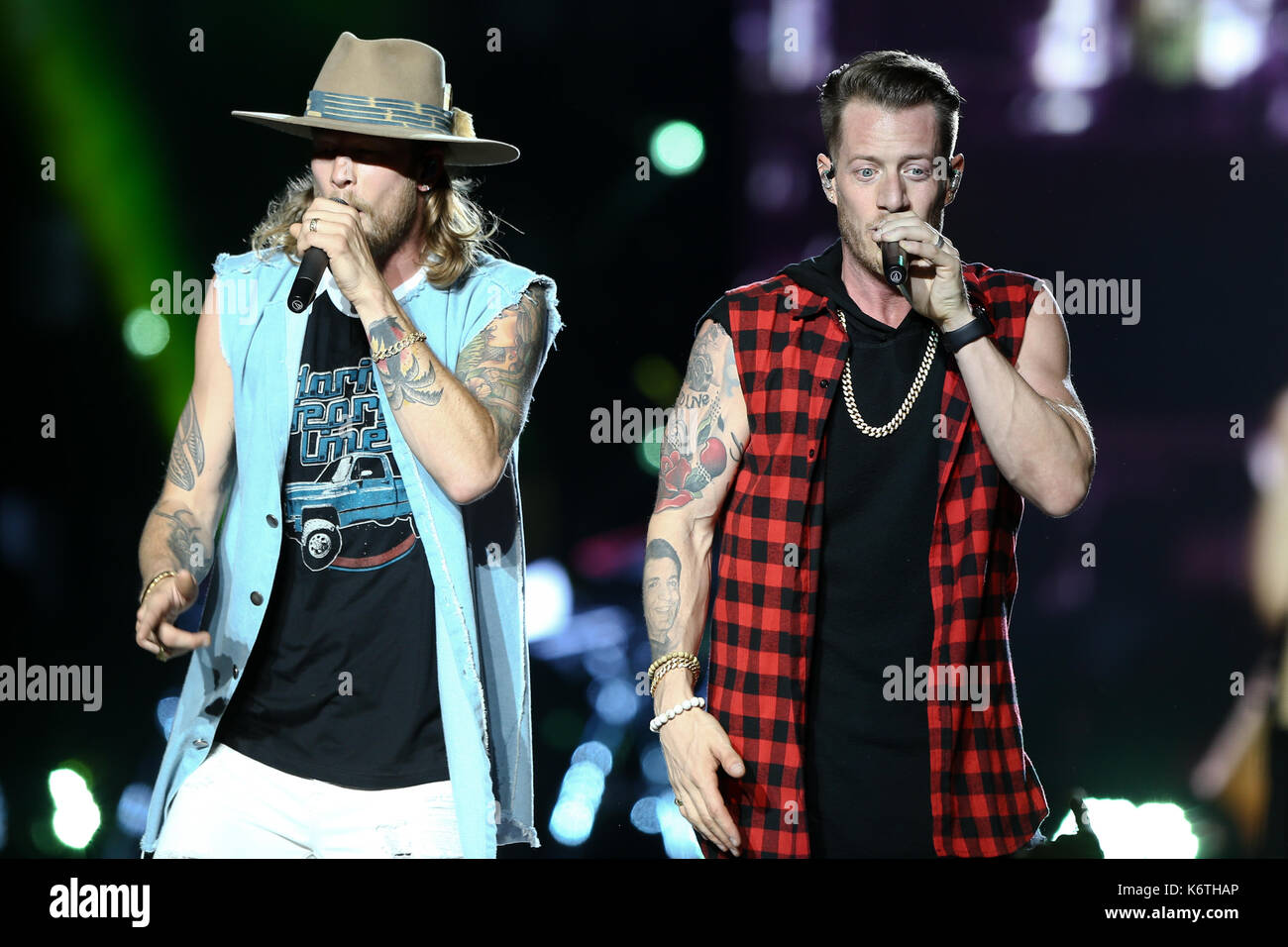 Brian Kelley (L) and Tyler Hubbard of Florida Georgia Line perform at Northwell Health at Jones Beach Theatre on June 15, 2017 in Wantagh, New York. Stock Photo