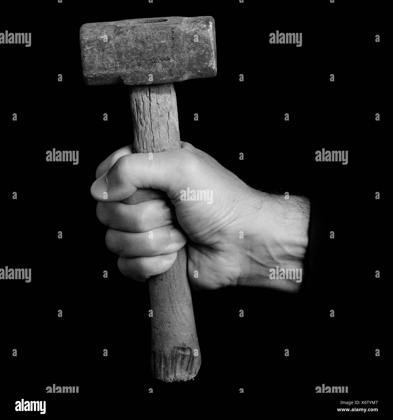 mallet - tools in a man's hand - black and white photo Stock Photo