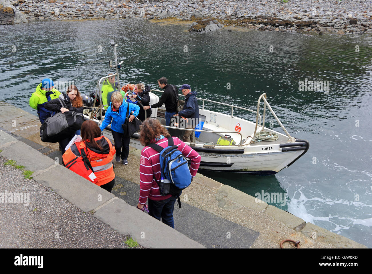 Small ferry boat, Torsa, taking passengers from Isle of Seil to Island of Easdale, Ellenabeich, Argyll, Scotland Stock Photo