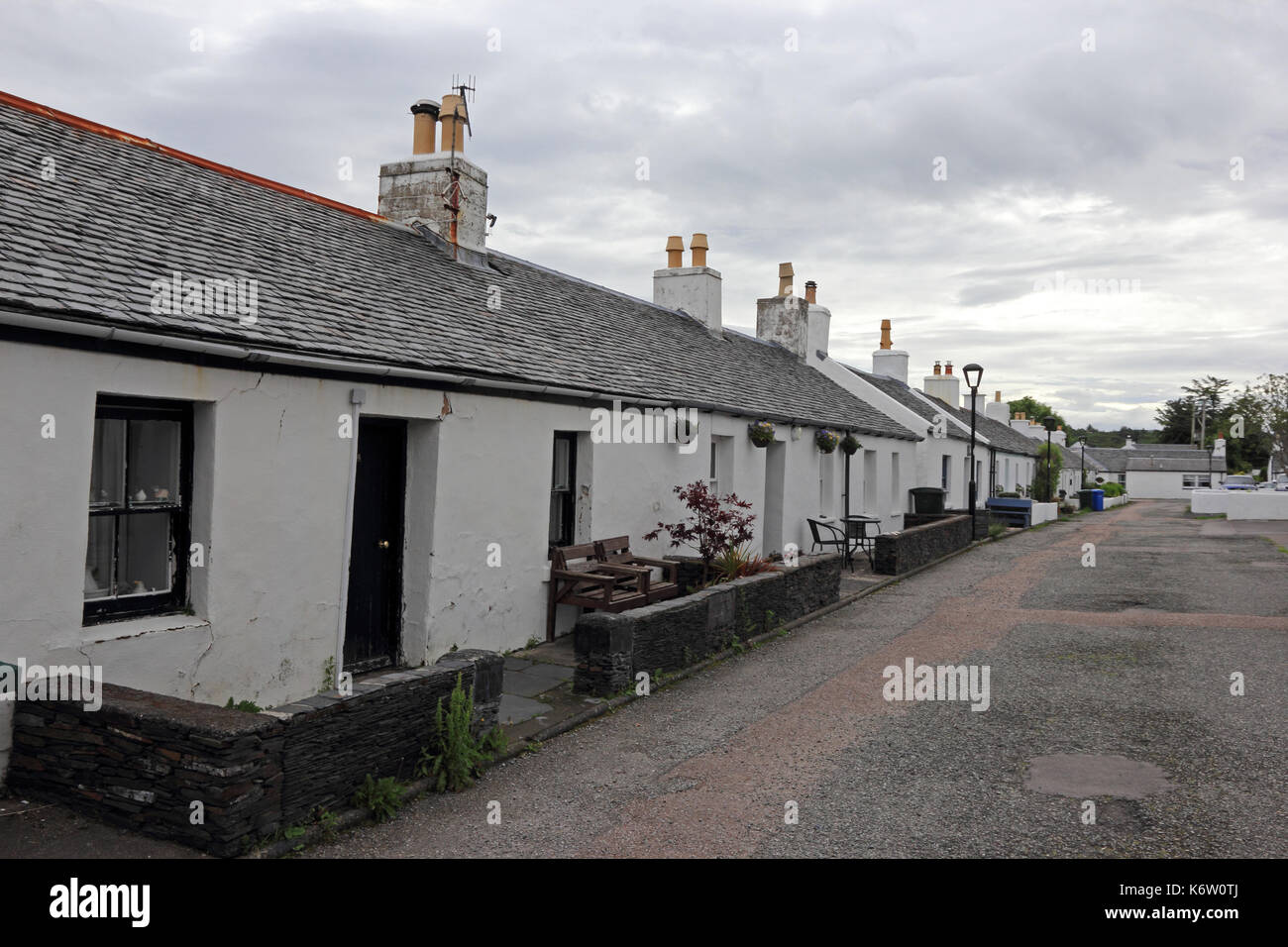 White cotages built to home miners at slate quarry, Ellenabeich, Isle of Seil, Scotland Stock Photo