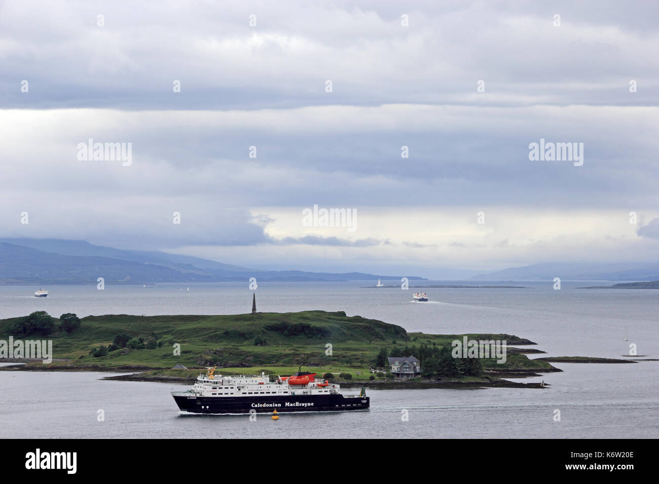 Caledonian MacBrayne ferry 'Clansman' passing Kerrera island to enter harbour at Oban, Scotland, with Mull in the distance. Stock Photo
