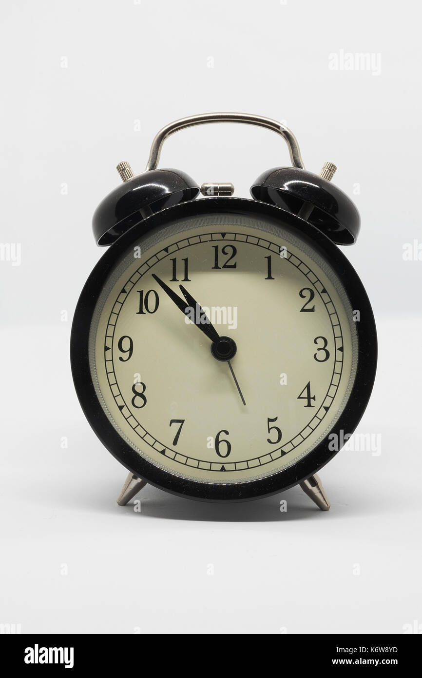 analog black alarm clock isolated on white background Stock Photo - Alamy