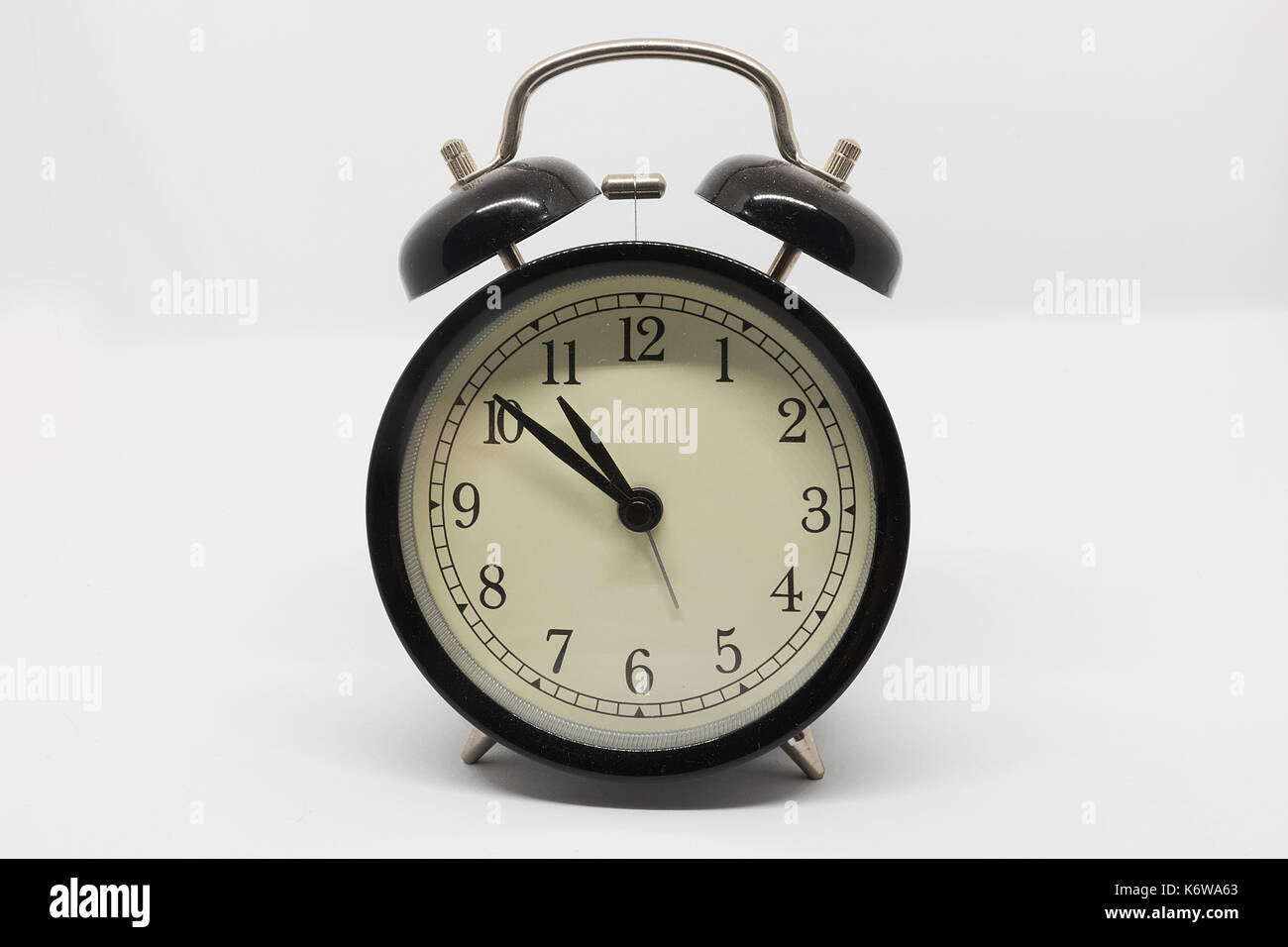 analog black alarm clock isolated on white background Stock Photo - Alamy