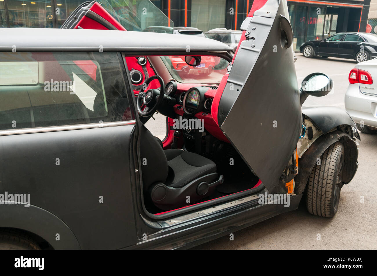 A modified Mini fitted with LSD hinges to give it scissor doors, work