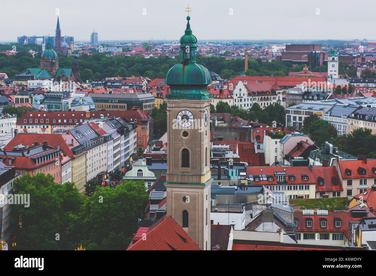 Beautiful super wide-angle sunny aerial view of Munich, Bayern, Bavaria, Germany with skyline and scenery beyond the city, seen from the height Stock Photo