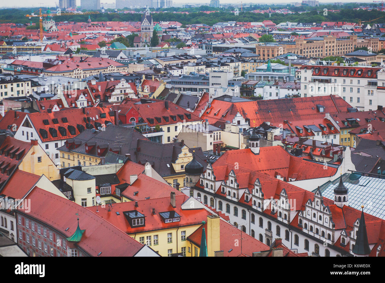Beautiful super wide-angle sunny aerial view of Munich, Bayern, Bavaria, Germany with skyline and scenery beyond the city, seen from the height Stock Photo