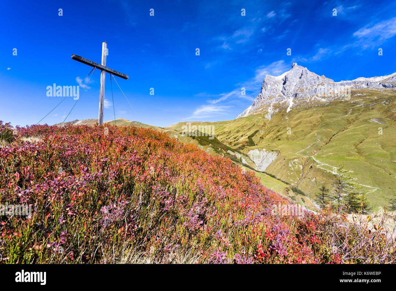 Peace cross on the Simmel, behind Großer Widderstein, 2533 m, Vorarlberg, Austria Stock Photo